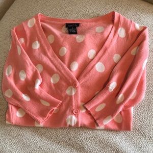 Pink and white polka dotted cardigan sweater